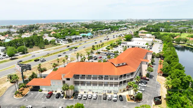 an aerial view of residential houses with outdoor space