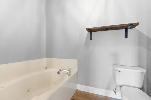 a bathroom with a sink a mirror and shower