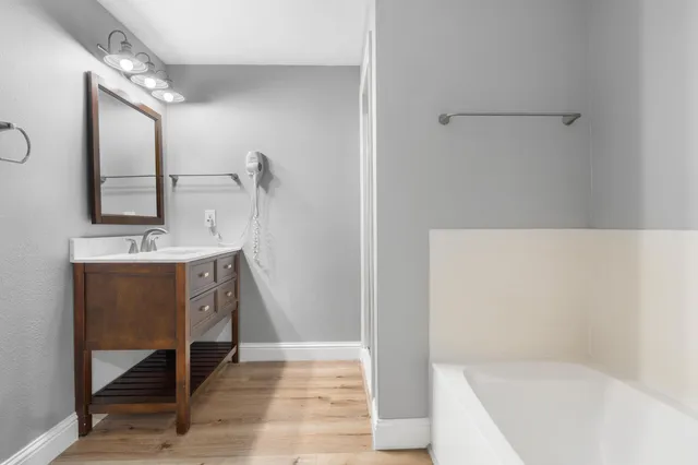 a bathroom with a sink and a mirror