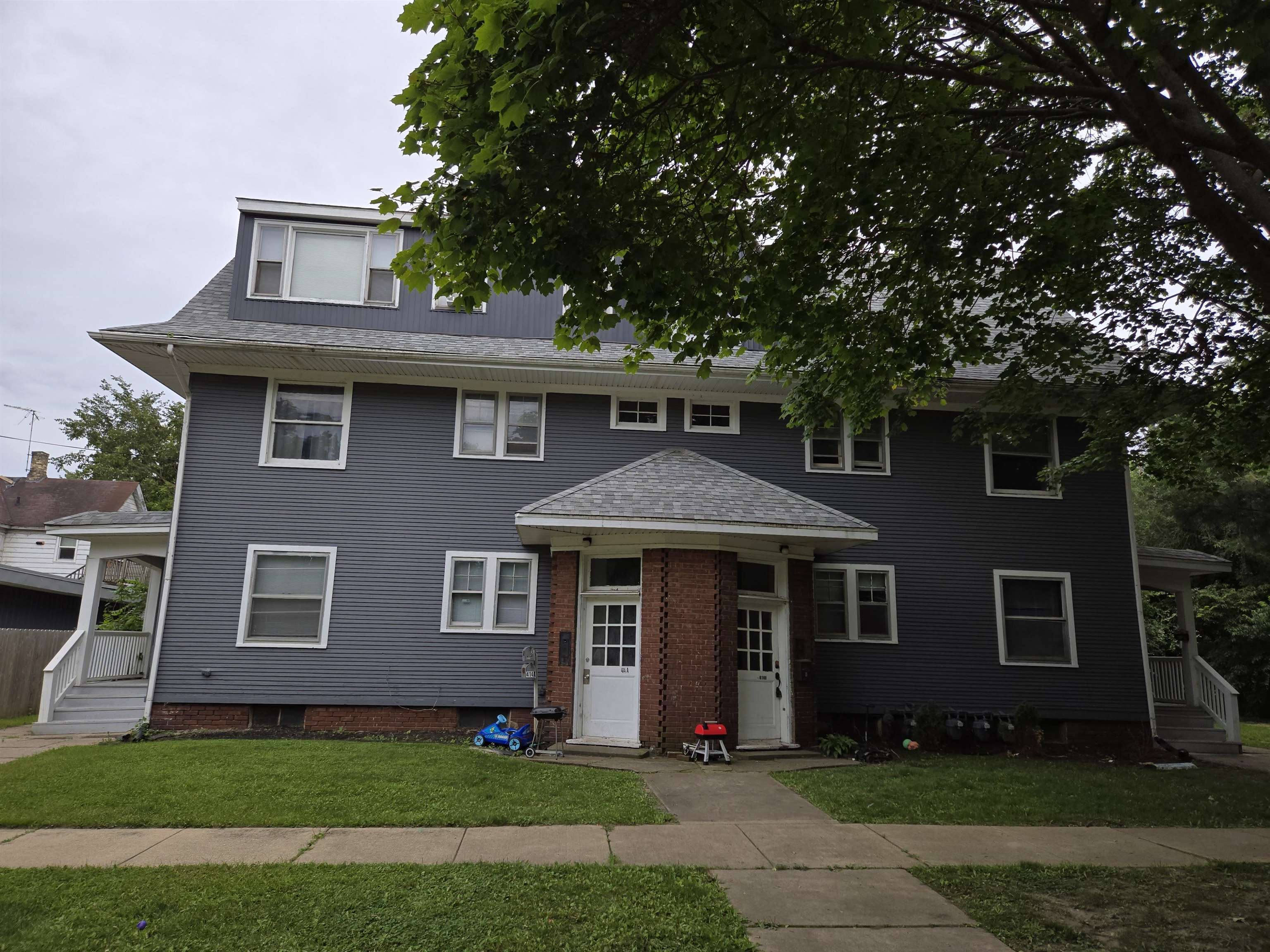 412-414 May Street Rockford, IL 61104 - Photo 1 of 11 a front view of a house with a yard