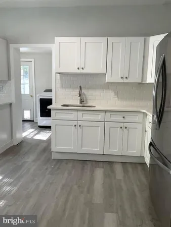 a view of a kitchen with electric appliances