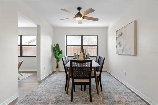 a view of a dining room with furniture and window