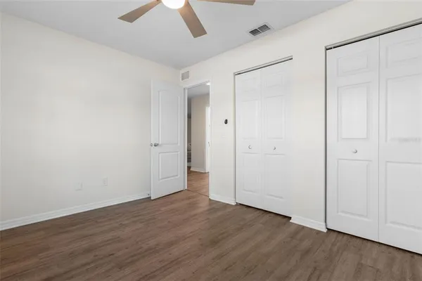 an empty room with wooden floor
