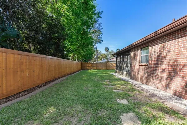 a view of backyard with green space