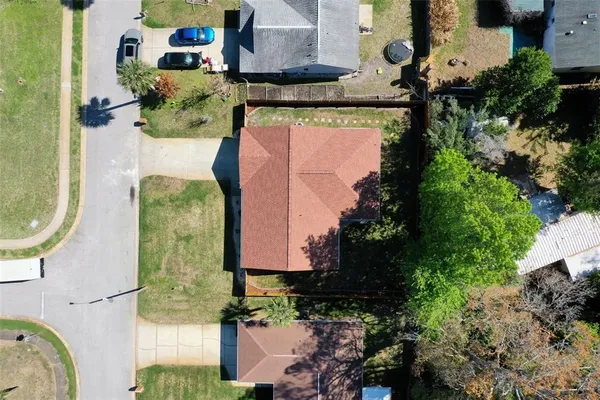 an aerial view of a house with outdoor space