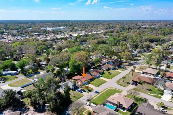 an aerial view of a houses with a lake view