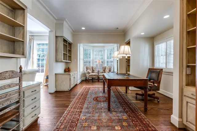 a view of a livingroom with furniture window and wooden floor