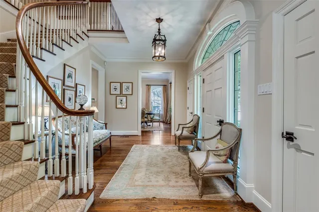 a view of a livingroom with furniture and staircase