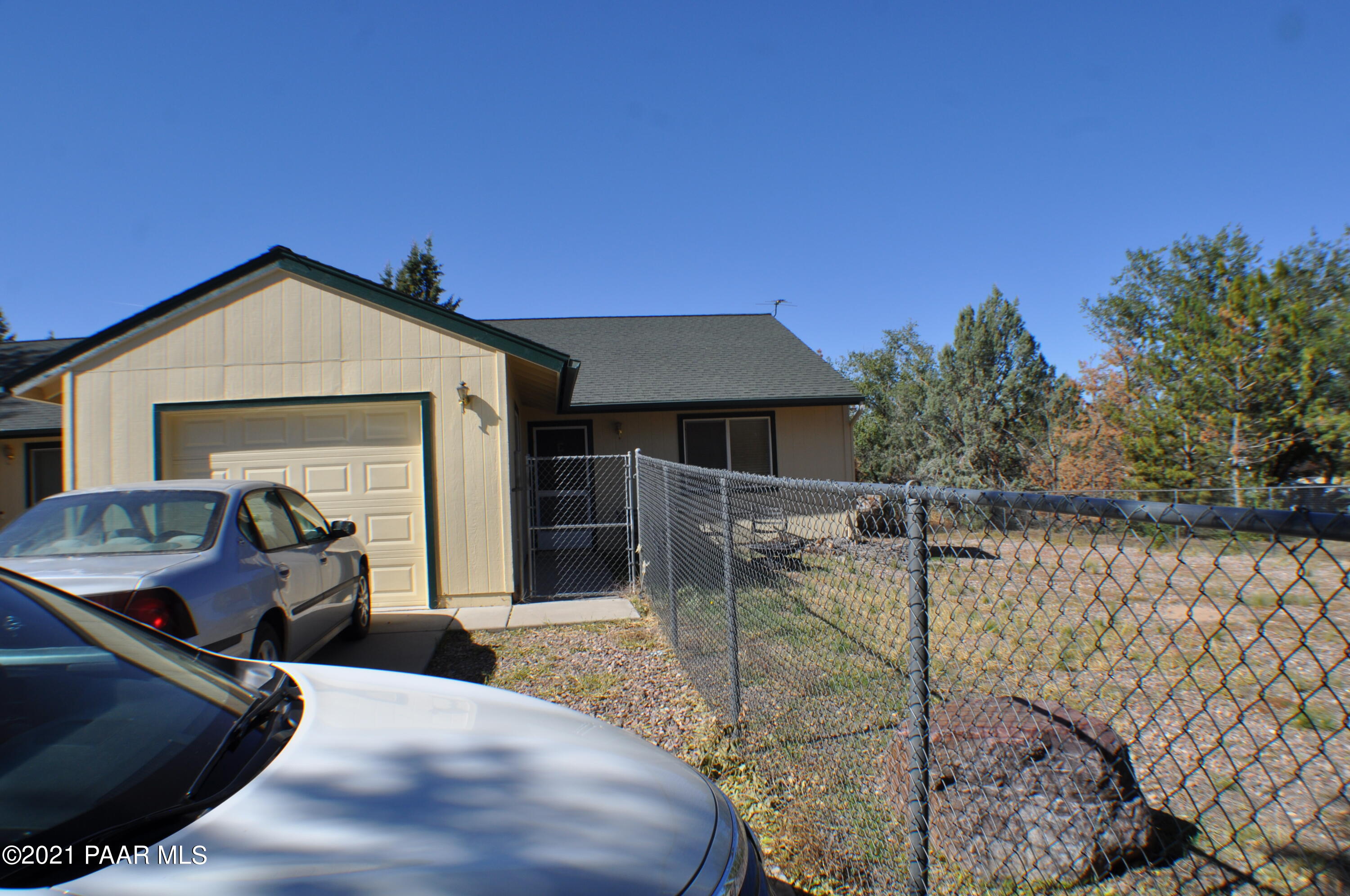 492 West Perkinsville Road Chino Valley, AZ 86323 - Photo 4 of 7 a view of a house with backyard outdoor seating area and furniture