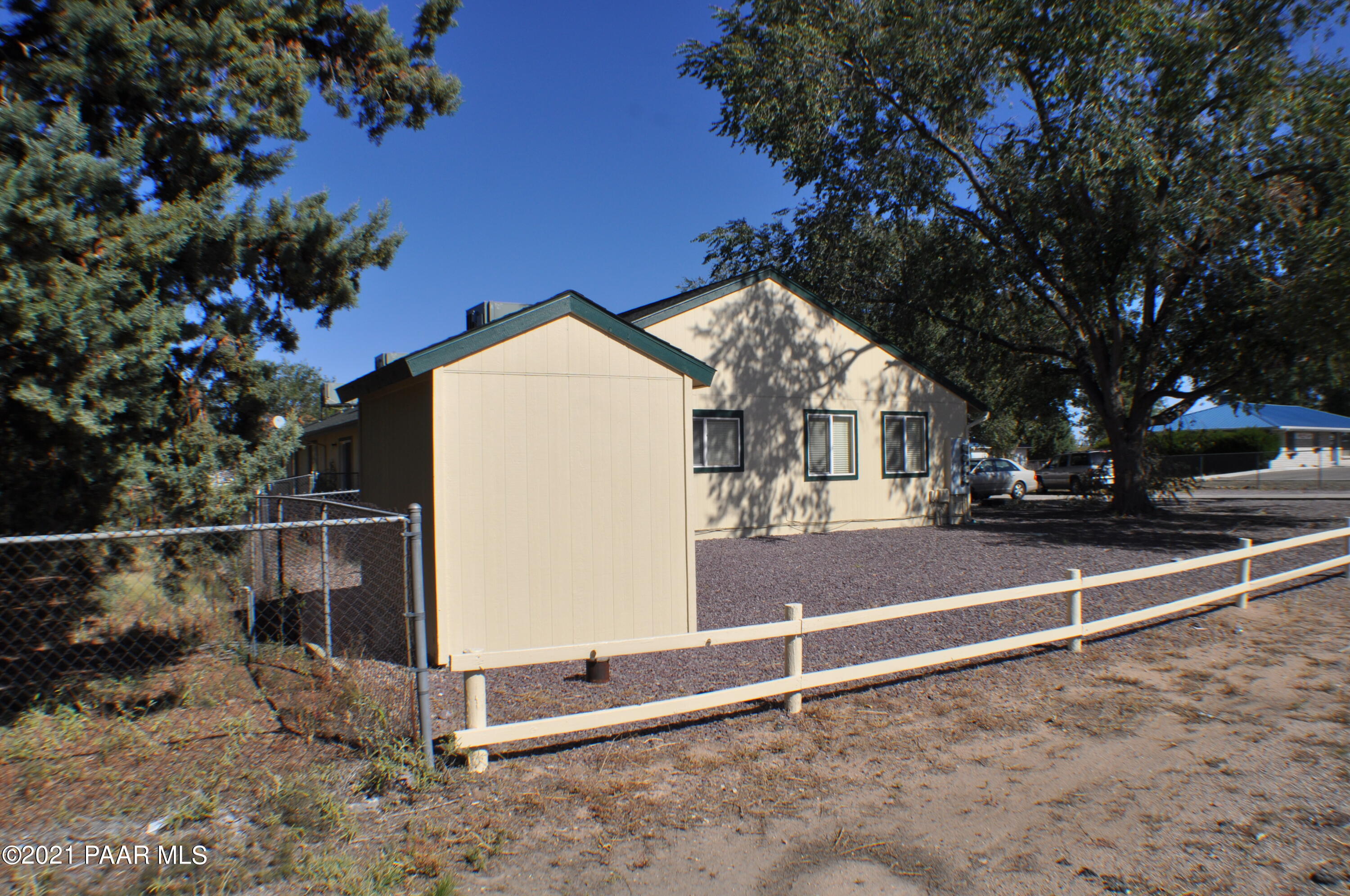 492 West Perkinsville Road Chino Valley, AZ 86323 - Photo 6 of 7 a view of a house with a yard and tree s