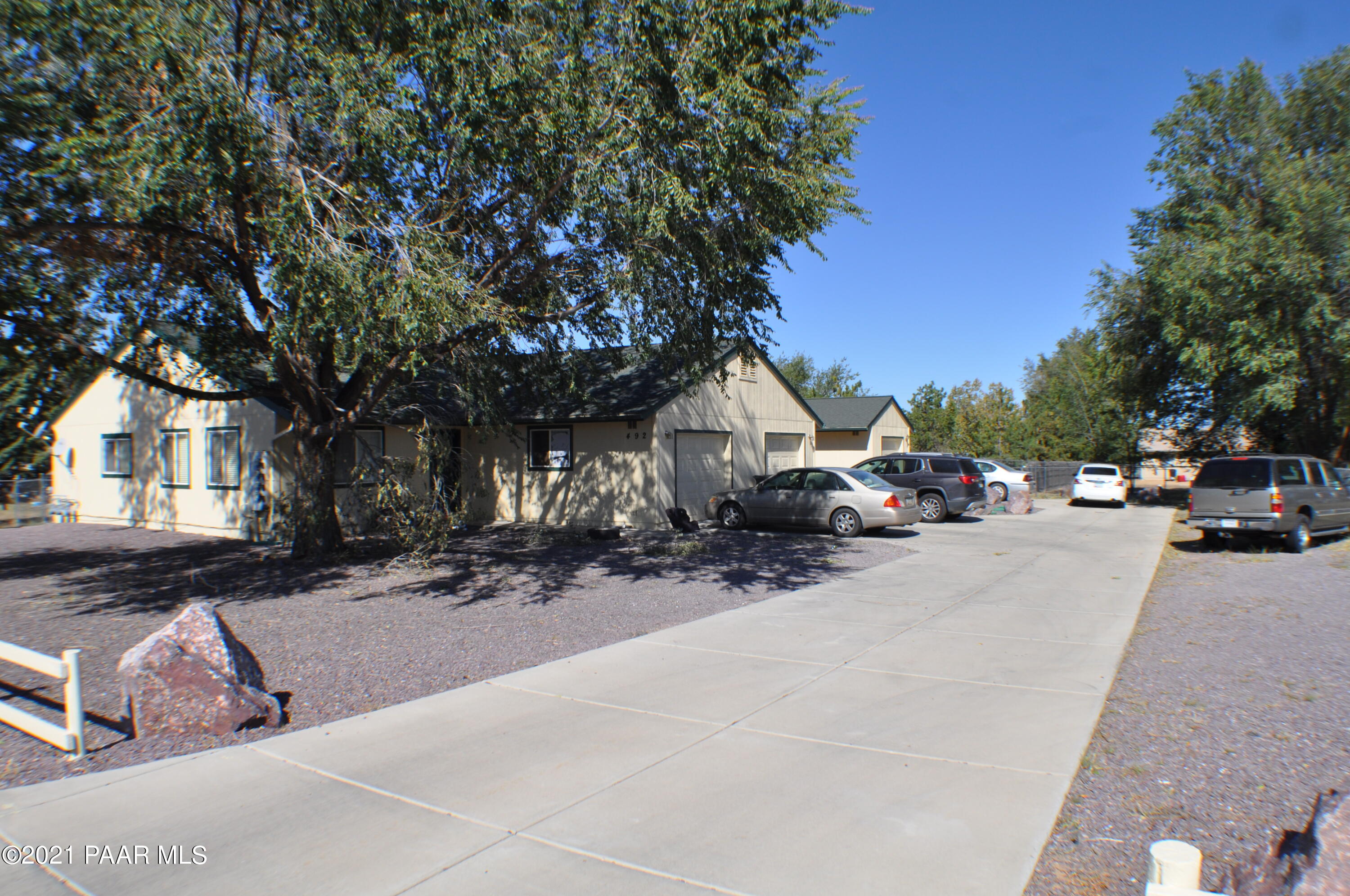 492 West Perkinsville Road Chino Valley, AZ 86323 - Photo 7 of 7 a view of road with card parked on side and retail shops