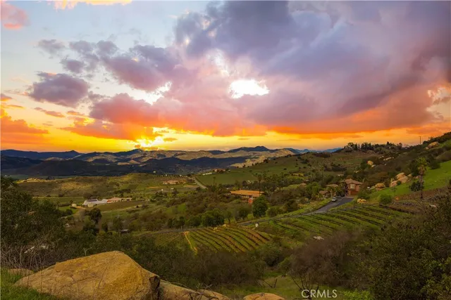 a view of an ocean and a mountain
