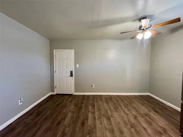 a view of room with wooden floor
