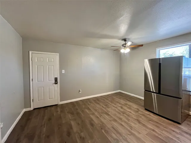 a view of a livingroom with a refrigerator