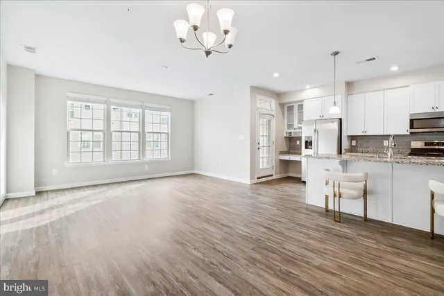 a view of kitchen with granite countertop cabinets a sink and dishwasher