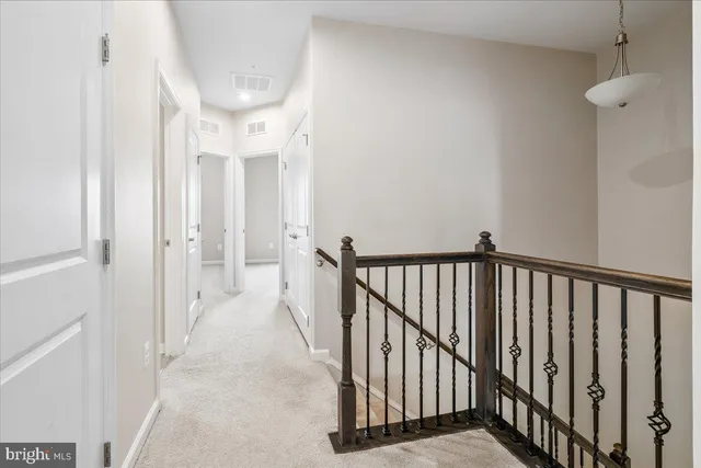a view of a hallway with washer and dryer