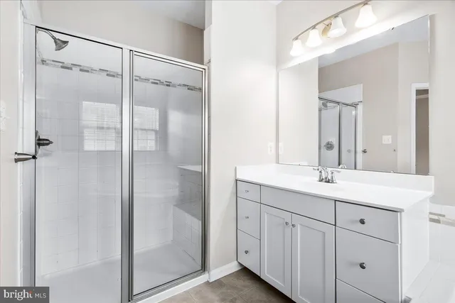 a white bath tub sitting in a bathroom next to a window