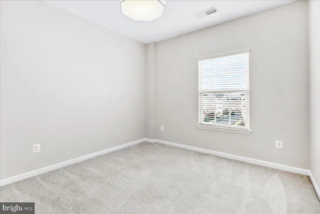 a bathroom with a double vanity sink toilet and a mirror