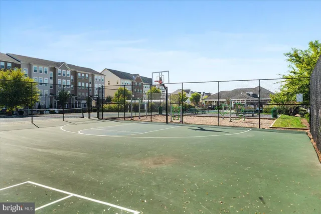 a view of an outdoor space and basketball court