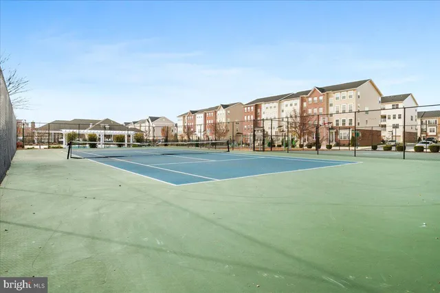 a view of an outdoor space and tennis court