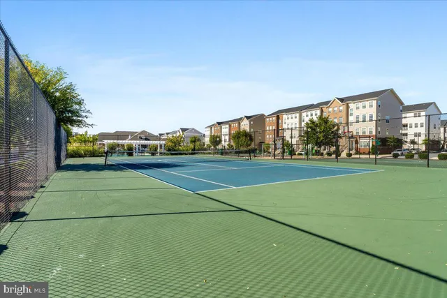 a view of house with a yard and plants