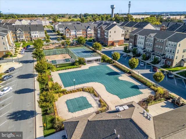 a view of a swimming pool with a table and chairs