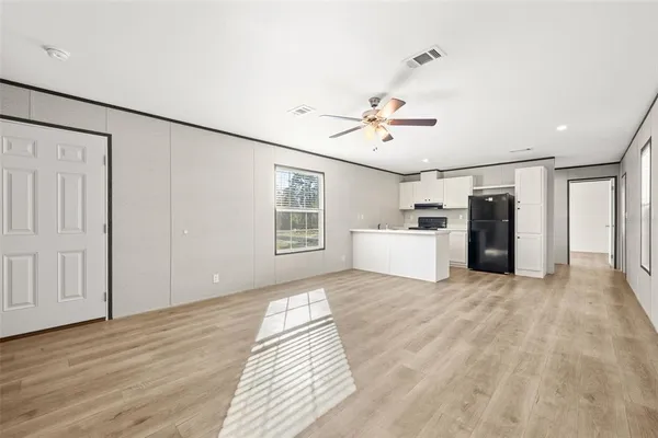 a view of a livingroom with furniture and wooden floor
