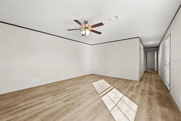 a view of an empty room with a window