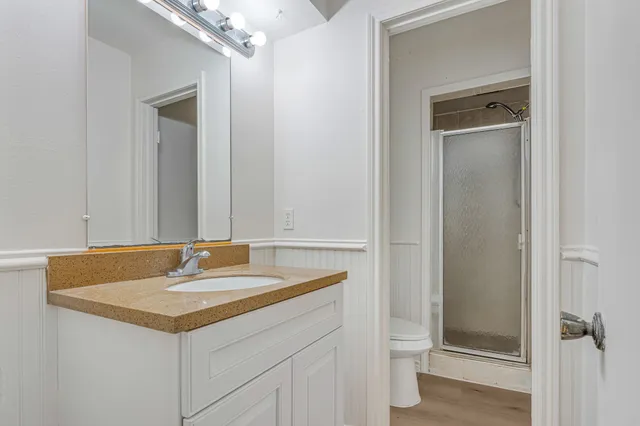 a bathroom with a sink vanity and a mirror