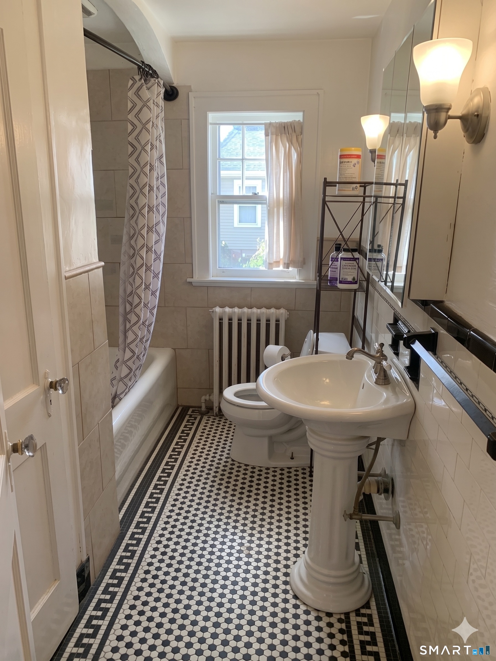 44 Bird Street Torrington, CT 06790 - Photo 13 of 17 a bathroom with a sink toilet and shower