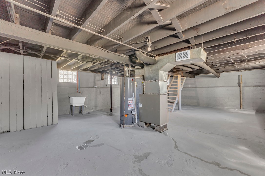12905 Watterson Avenue Cleveland, OH 44105 - Photo 27 of 30 Basement featuring gas water heater and heating unit