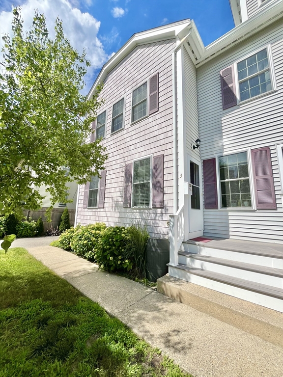19 Lafayette Road, Unit 3 Ipswich, MA 01938 - Photo 1 of 41 a front view of a house with a garden