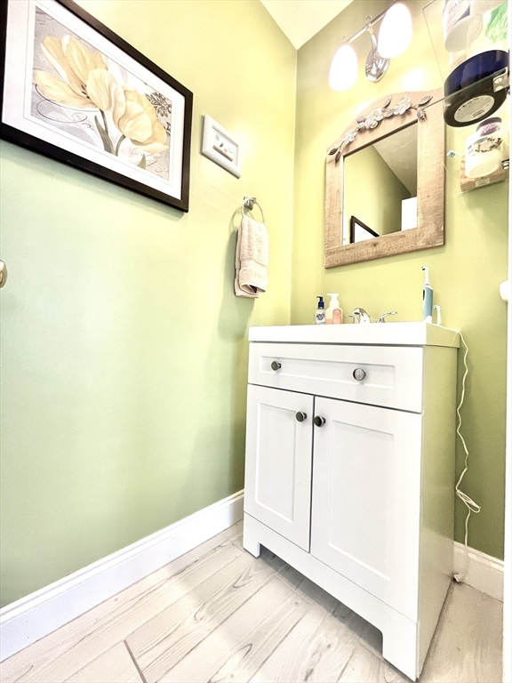 19 Lafayette Road, Unit 3 Ipswich, MA 01938 - Photo 13 of 41 a bathroom with a sink and a mirror