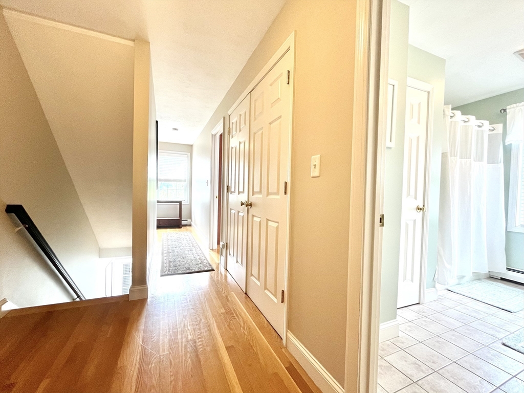 19 Lafayette Road, Unit 3 Ipswich, MA 01938 - Photo 17 of 41 a view of a hallway with wooden floor and staircase