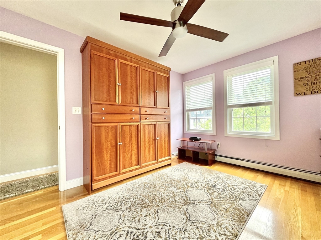 19 Lafayette Road, Unit 3 Ipswich, MA 01938 - Photo 26 of 41 a bed room with a bed and a couch