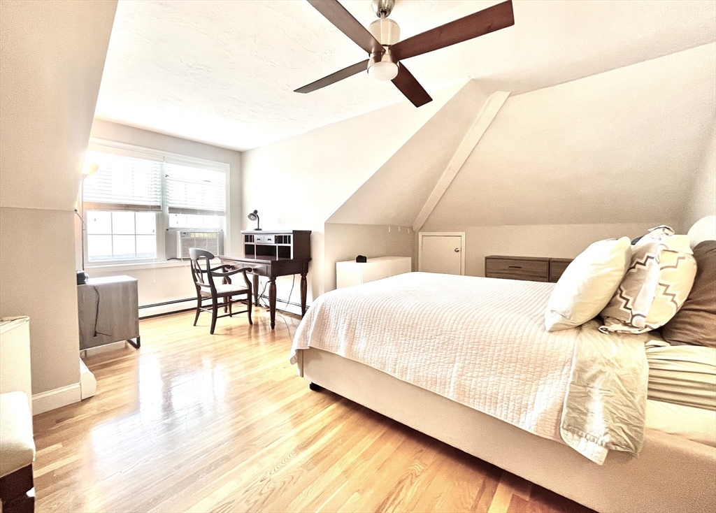 19 Lafayette Road, Unit 3 Ipswich, MA 01938 - Photo 28 of 41 a bedroom with a bed and a table