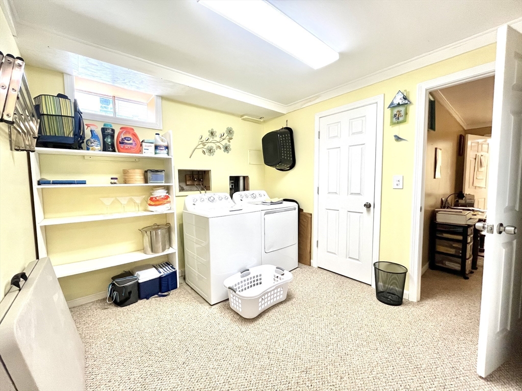 19 Lafayette Road, Unit 3 Ipswich, MA 01938 - Photo 29 of 41 a storage room with washer and dryer