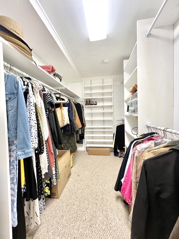 19 Lafayette Road, Unit 3 Ipswich, MA 01938 - Photo 31 of 41 a view of walk in closet with clothes and shoes