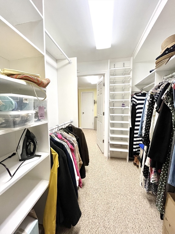 19 Lafayette Road, Unit 3 Ipswich, MA 01938 - Photo 32 of 41 a view of walk in closet with clothes and shoes