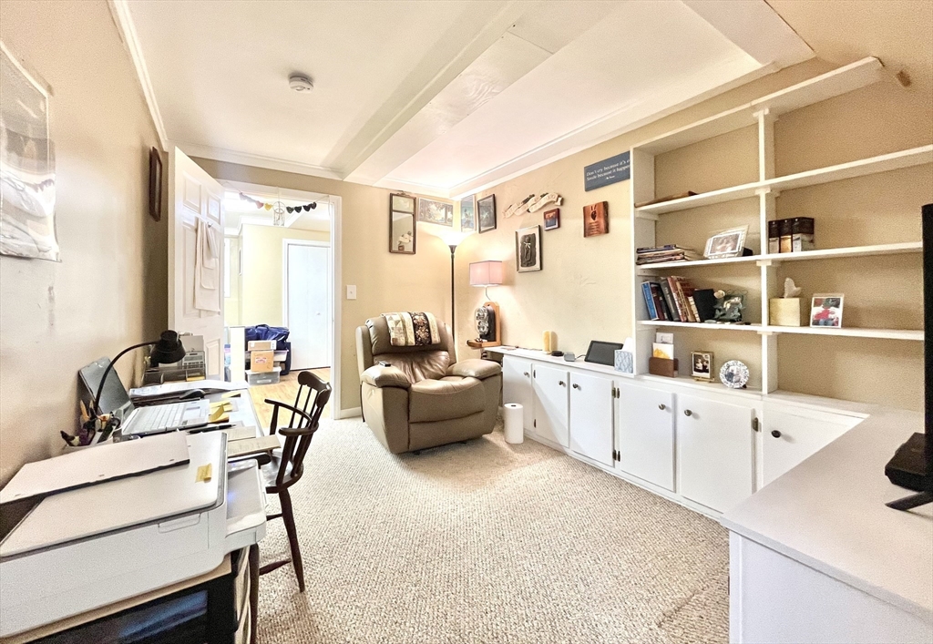 19 Lafayette Road, Unit 3 Ipswich, MA 01938 - Photo 33 of 41 a living room with furniture a rug and white walls