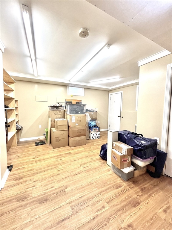 19 Lafayette Road, Unit 3 Ipswich, MA 01938 - Photo 34 of 41 a bed room with furniture and a lamp