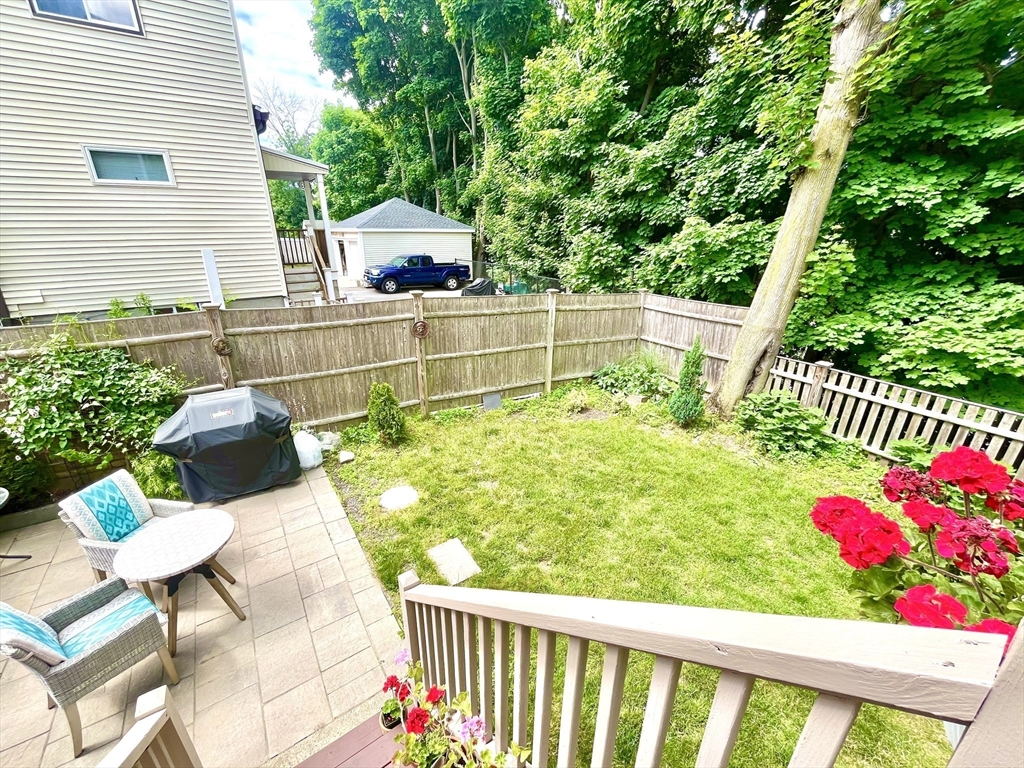 19 Lafayette Road, Unit 3 Ipswich, MA 01938 - Photo 36 of 41 a balcony with couple of flower plants