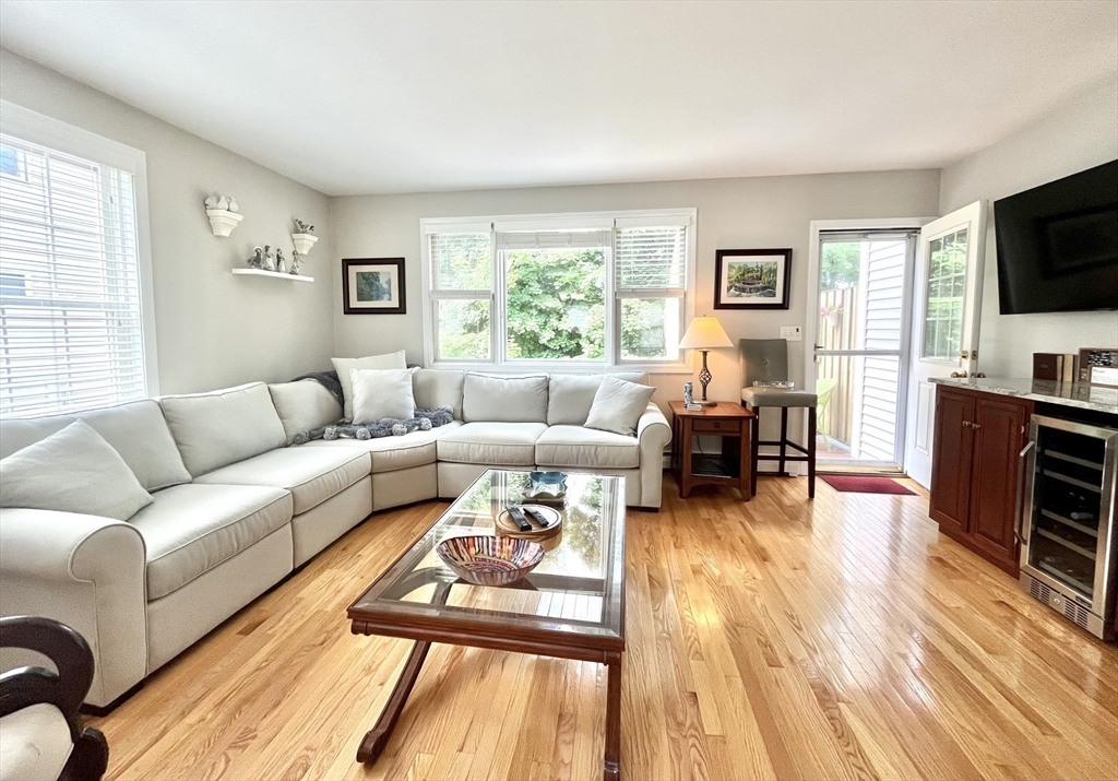 19 Lafayette Road, Unit 3 Ipswich, MA 01938 - Photo 9 of 41 a living room with furniture and a flat screen tv