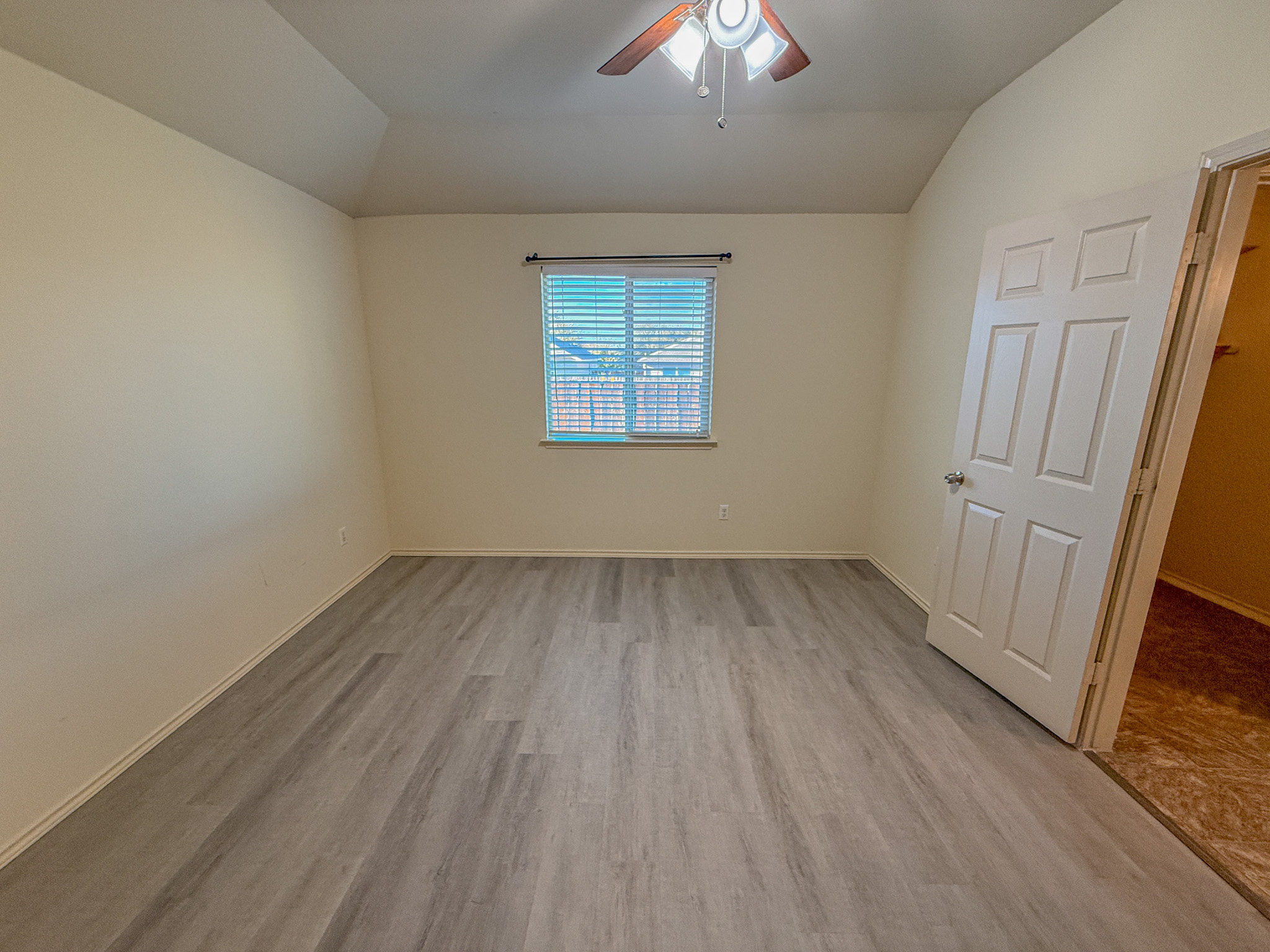412 Azurite Drive Jarrell, TX 76537 - Photo 13 of 23 wooden floor in an empty room with a window