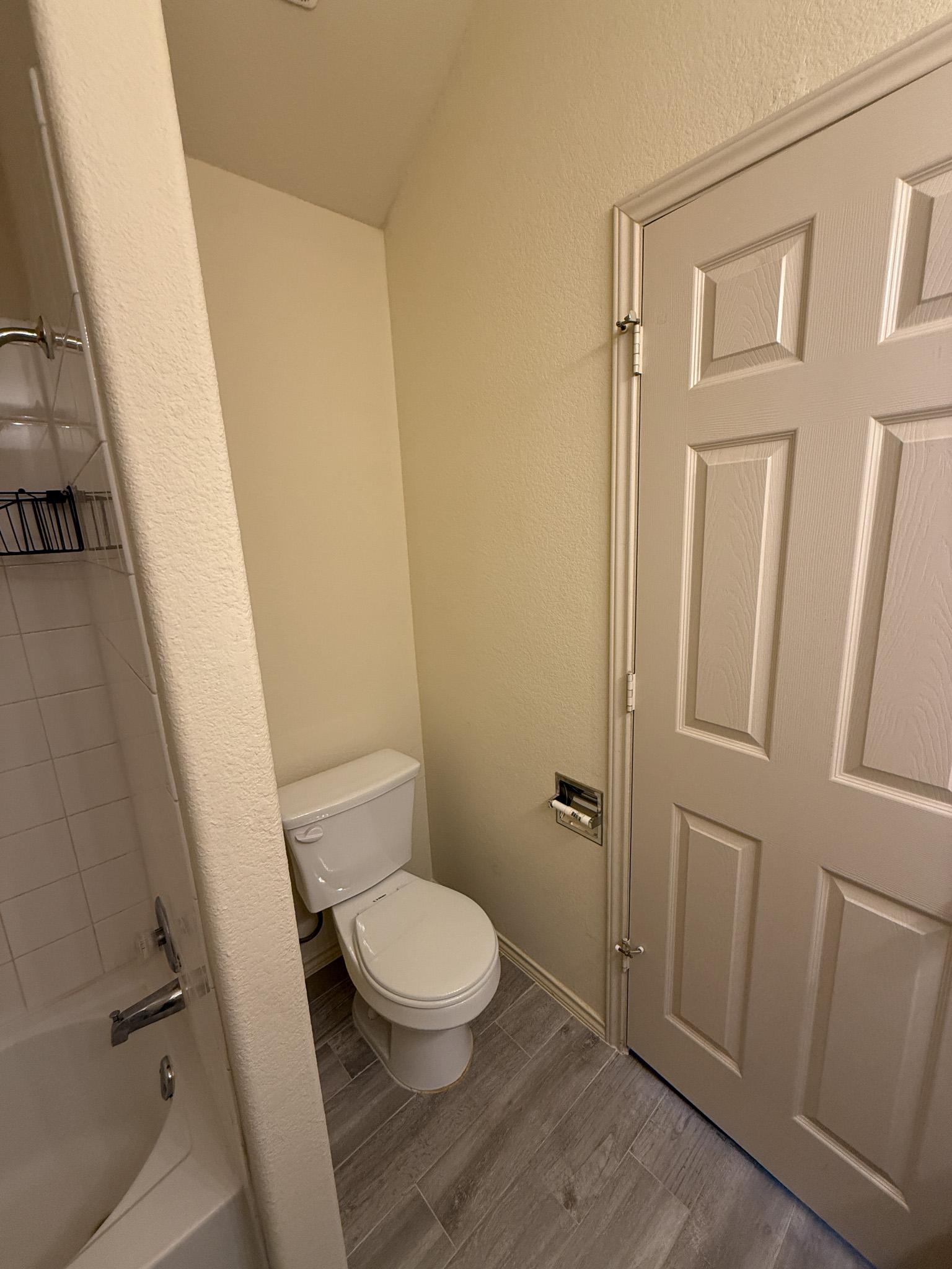 412 Azurite Drive Jarrell, TX 76537 - Photo 16 of 23 a white toilet sitting next to a bathroom sink and vanity