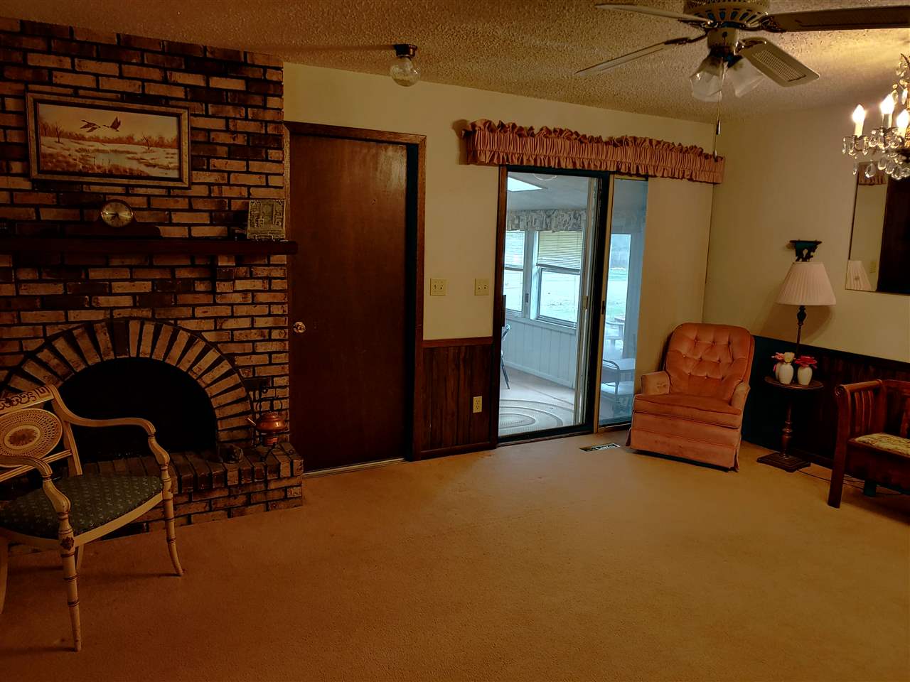 2874 Karr Road Belvidere, IL 61008 - Photo 11 of 20 a living room with furniture and a chandelier