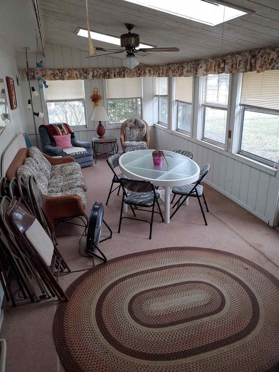 2874 Karr Road Belvidere, IL 61008 - Photo 12 of 20 a living room with furniture and a table