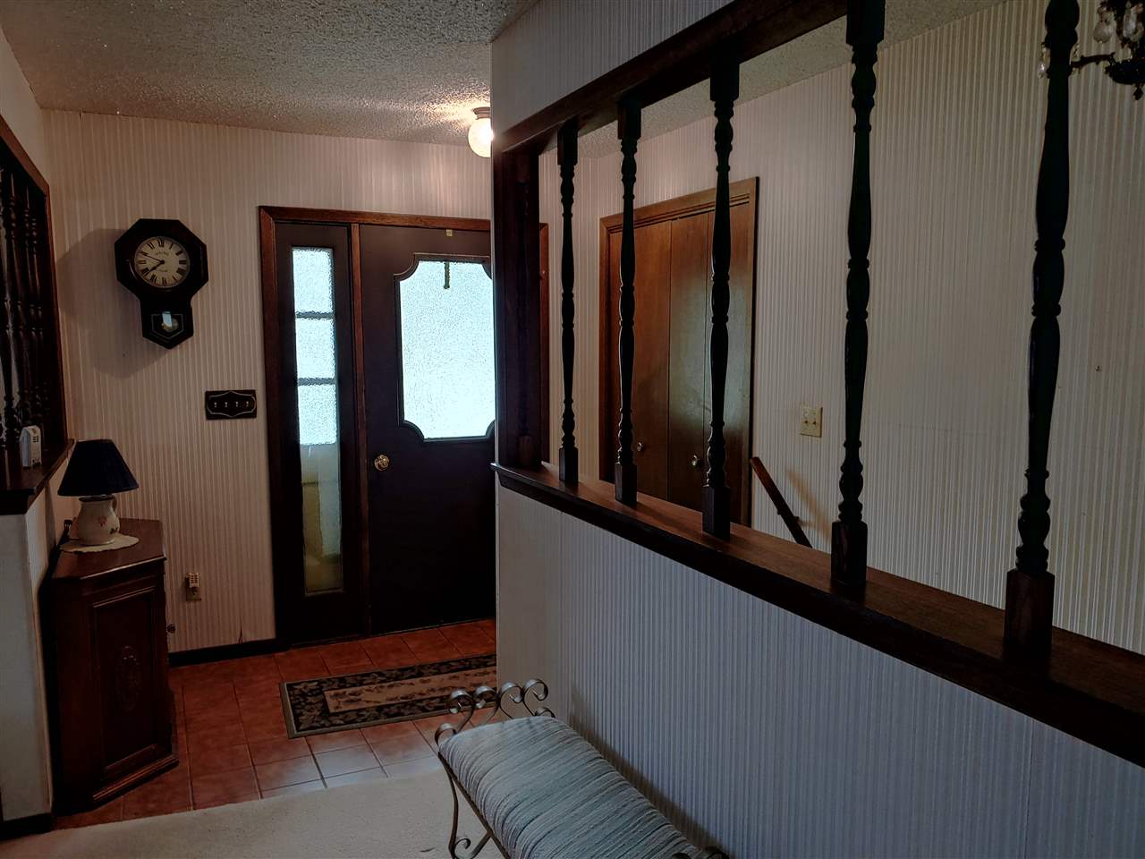 2874 Karr Road Belvidere, IL 61008 - Photo 3 of 20 a view of staircase with a potted plant on a table and a large window