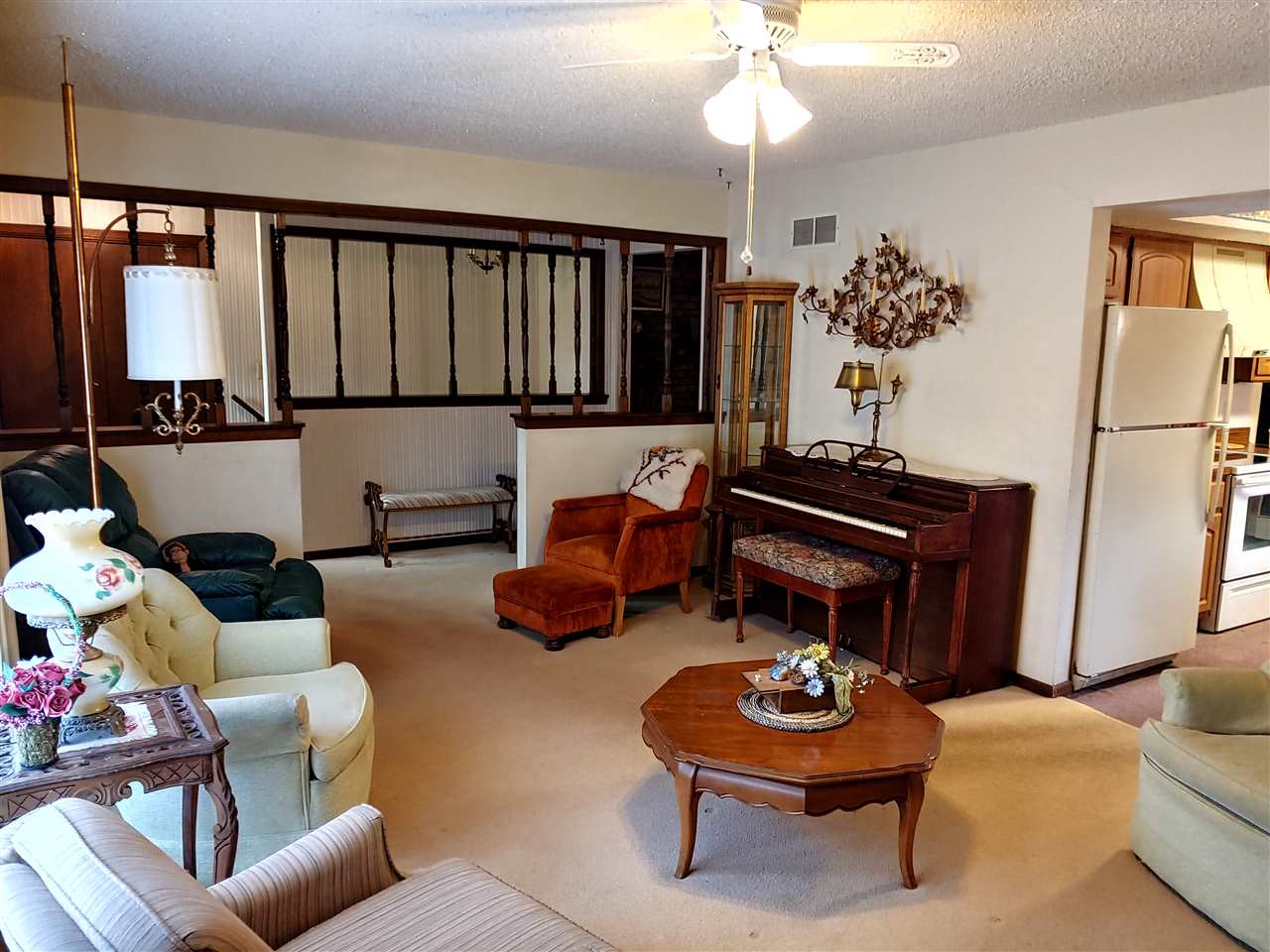 2874 Karr Road Belvidere, IL 61008 - Photo 5 of 20 a living room with furniture a rug and a chandelier