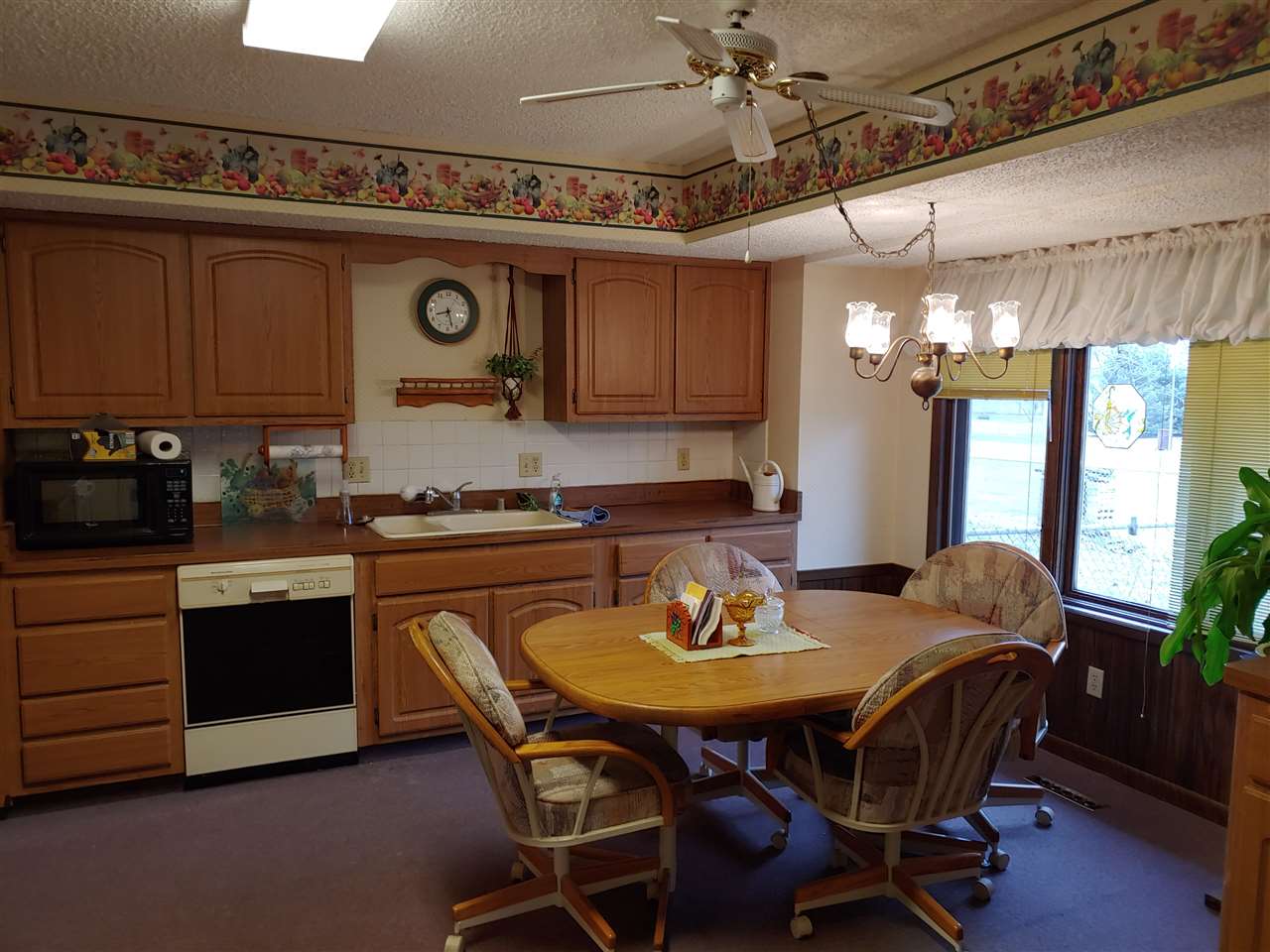 2874 Karr Road Belvidere, IL 61008 - Photo 7 of 20 a kitchen with a dining table and chairs